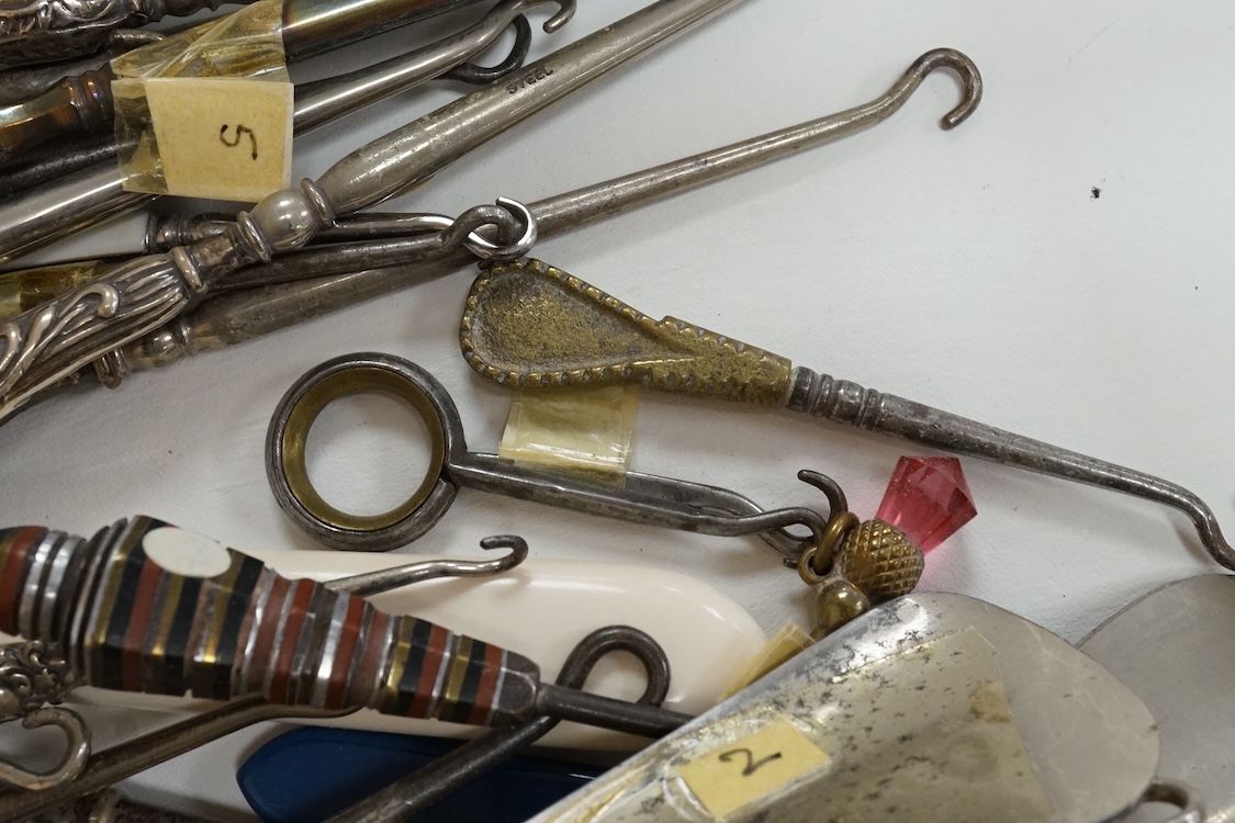 A large collection of Victorian button hooks, with silver, plate, mother of pearl and other handles